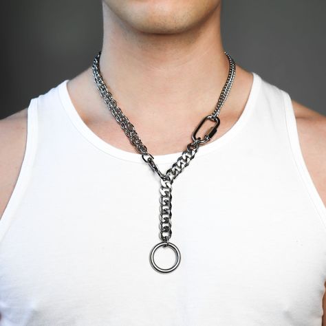 DESCRIPTION: Be industrial chic with this Kreuzberg necklace. Constructed from high-grade stainless steel and reconstructed chains, it features an O-ring and carabiner for a warehouse-style, super-trendy grunge look. Perfect for any edgy high-key look.  This piece will not turn skin green or tarnish DETAILS: available in 2 sizes stainless steel adjustable  warehouse grunge waterproof FIT: Model wears a 15 1/2 inch collar and is wearing the 23 in sizing WWW.THESIBSHOP.COM