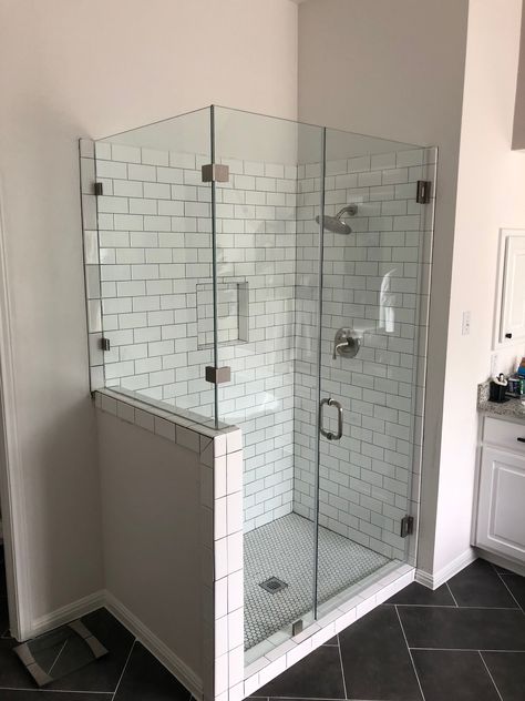 Shower With Two Glass Walls, Frameless Shower Doors With Pony Wall, Diy Glass Shower Enclosure, Full Glass Shower Enclosure, Glass Wall Shower Ideas, Swan Stone Shower Walls, Shower Door With Half Wall, Glass Shower Ideas, Shower Enclosure Ideas