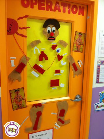 What a fun way to decorate the center! Each classroom is a different board game theme! Operation Game Door Decoration, Pe Classroom, Nurse Bulletin Board, Board Game Themes, School Nurse Office, Classroom Science, Game Decor, Teacher Survival, Staff Development