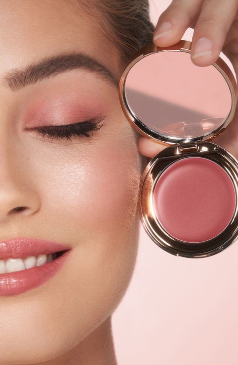 What it is: A hybrid lip-blush tint for weightless, buildable color. The easy-to-use cream formula glides on effortlessly for a dewy, sun-kissed glow.What it does: Charlotte's secret to sun-kissed skin in seconds. This multi-use, buildable product adds the perfect wash of color to the lips and cheeks. Infused with skin-loving ingredients like vitamin E and raspberry leaf stem cell extract, it moisturizes and revitalizes the look of skin. How to use: For a blush of color, apply to the apples of t Blush And Lipstick In One, Dewy Skin Aesthetic, Blush Photoshoot, Charlotte Tilbury Blush, Best Cream Blush, Charlotte Tilbury Looks, Youthful Makeup, Blush Aesthetic, Blush Tint