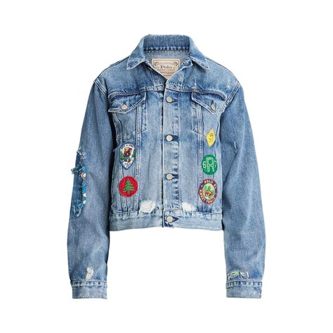 This version of Polo’s trucker jacket is embroidered with an array of colorful patches that nod to the great outdoors. The cotton-blend denim has a light vintage-inspired hue with uneven hand-sanding grinding at the seams and rip-and-repair details throughout. Vintage Patches Jacket, Denim Jacket With Patches, Sweatpants And Sweater, Jacket With Patches, Wimbledon Fashion, Patch Denim, Patch Jacket, Denim Jacket Patches, Denim Trucker Jacket