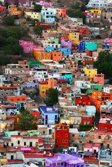 The colorful shanty town of Favela, in Brazil. The first favelas appeared in the late 19th century and were built by soldiers who had nowhere to live. Some of the first settlements were called bairros africanos (African neighbourhoods). This was the place where former slaves with no land ownership and no options for work lived. Favelas Brazil, Colorful Buildings, Diego Rivera, Pretty Places, Oh The Places Youll Go, Dream Destinations, Places Around The World, Travel Bucket, Cancun