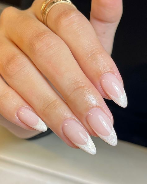 #pearlnails #frenchtipnails #frenchtipwithatwist #classynails #almondnails #biabnails #bridalnails #weddingnails #marblenails Almond Gel X French Tip, White French Tip Bridal Nails, Ivory French Tip Nails, Elevated French Tip Nails, Pearl White French Tip Nails, Pearl Tip Acrylic Nails, Bridal French Tip, White Tip Nail Ideas, Bridal Nail Ideas Brides