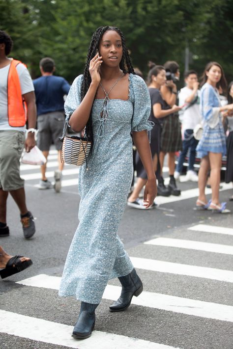 This Is How You Should Be Styling Your Maxi Dress This Season, According to Street Style Stars Maxi Dress Cowboy Boots, Dress Cowboy Boots Outfit, Bright Pink Maxi Dress, Cowboy Boots Outfit Winter, Dress With Cowboy Boots, Dress And Cowboy Boots Outfit, Dress Cowboy Boots, Cowboy Boots Outfit, Dresses With Cowboy Boots