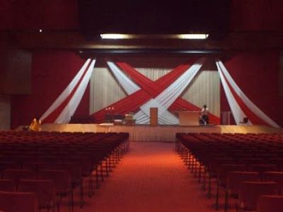 Simple Church Stage Designs | Feb 27 2011 Stage Backdrop Design Red and White Drapes at The Feast ... Fabric Stage Design, Reception Stage Backdrop, Wedding Reception Stage, Backdrop Draping, Graduation Stage, Stage Backdrop Design, Draping Ideas, Reception Stage, Christmas Stage