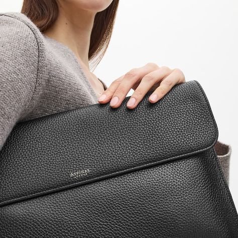 Our Leather Laptop Case is the stylish answer to carrying your laptop on the go. Handcrafted from full-grain leather, a flap closure opens to reveal a single compartment lined in butter soft grosgrain which accommodates your laptop. A magnetic-dot closure and corner stitching complete the design. Create a truly unique gift for yourself or a loved one by personalising our Leather Laptop Case with our luxury personalisation service. Corner Stitching, Artist Portfolio Book, Leather Laptop Case, Aspinal Of London, Black Pebbles, Leather Laptop, Leather Sleeve, Mens Leather, Laptop Case