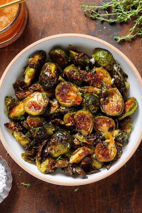 These Honey Balsamic Brussels Sprouts are the perfect balance between sweet and salty. They're crispy, flavorful, and so simple! They're easy enough to be served as a side for a weeknight dinner but they taste fancy enough to be a part of your holiday table! They make a great fall side dish for any occasion. Baked Brussel Sprouts Oven Balsamic, Barbecue Brussel Sprouts, Fancy Dinner Party Meals, Harissa Brussels Sprouts, Brussels Sprouts With Cheese, Brussels Sprout Roasted, Maple Soy Glazed Brussel Sprouts, Thanksgiving Side Dishes Brussel Sprouts, Brussels Sprout Sweet Potato