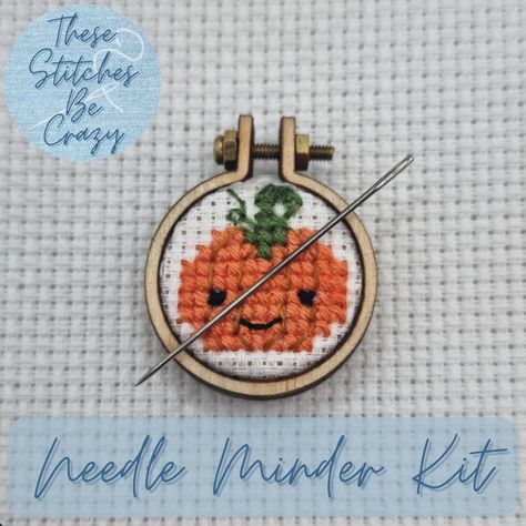 This listing is for a full kit to make your own Kawaii Pumpkin Needle Minder. You WILL NOT receive a ready assembled needle minder. PLEASE READ ALL INFORMATION BEFORE ORDERING If you have any questions at all feel free to message me! Included in this kit: Kawaii Pumpkin chart & full assembly instructions 4cm x 4cm piece of white 16 count aida DMC threads (310, 721, 782, 3346) 1 mini wooden embroidery hoop with screw & 2 hex nuts 1 handmade with love wooden button 2 neodymium magnets (1 pre-glued to middle section of embroidery hoop, 1 pre-glued to wooden button) 1 navy blue organza gift bag What else you will need (not included) Needle, superglue, tweezers, embroidery scissors, small clamps (optional) Types of stitches: Fractional cross stitch & backstitch The width of this needle minder i Mini Pumpkin Cross Stitch, Needle Minder Diy, Free Mini Cross Stitch Patterns, Small Cross Stitch Patterns Free Minis, Cross Stitch Blackwork, Kawaii Pumpkin, Kawaii Cross Stitch, Pumpkin Cross Stitch, Blackwork Cross Stitch