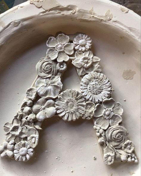 Ceramic flowered letter Clay Letters Diy, Ceramic Letters Ideas, Flower Carving Clay, Clay Letters, Ceramic Letters, 3d Ceramic Flower Wall Art, Contemporary Ceramics Flower, Ceramic Relief, Pottery Diy