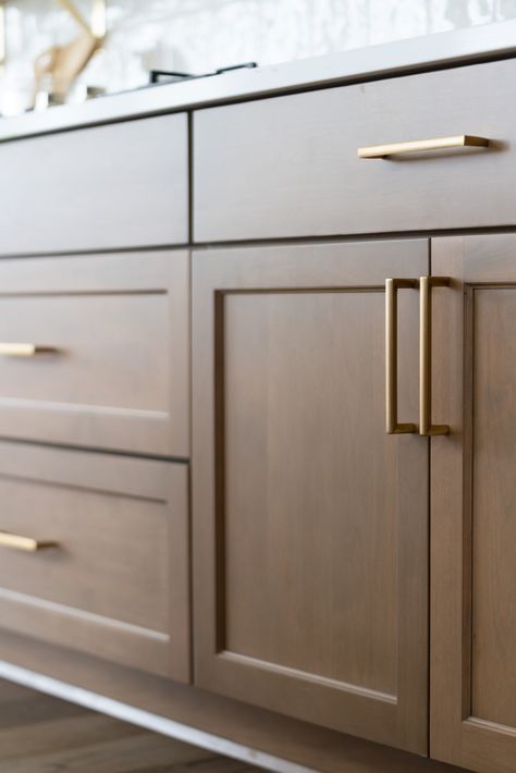 Gold Bronze Kitchen Hardware, Hazelnut Cabinets Kitchens, Brown Kitchen Cabinets With Gold Hardware, Brown Cabinets White Range Hood, Wood Cabinets Bronze Hardware, Maple Colored Kitchen Cabinets, Brown Kitchen Hardware, Dark Brown Kitchen Cabinets Brass Hardware, Brown Shaker Cabinets