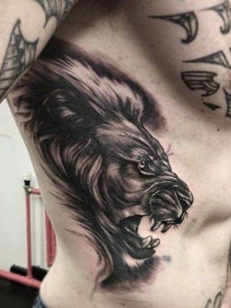 20 Cool Rib Tattoos for Men in 2021 - The Trend Spotter Mens Side Tattoos, Rib Tattoo Quotes, Flower Tattoo On Ribs, Best Tattoo Ideas For Men, Rib Tattoos For Guys, Tattoos On Side Ribs, Ab Tattoo, Places To Get Tattoos, Small Chest Tattoos