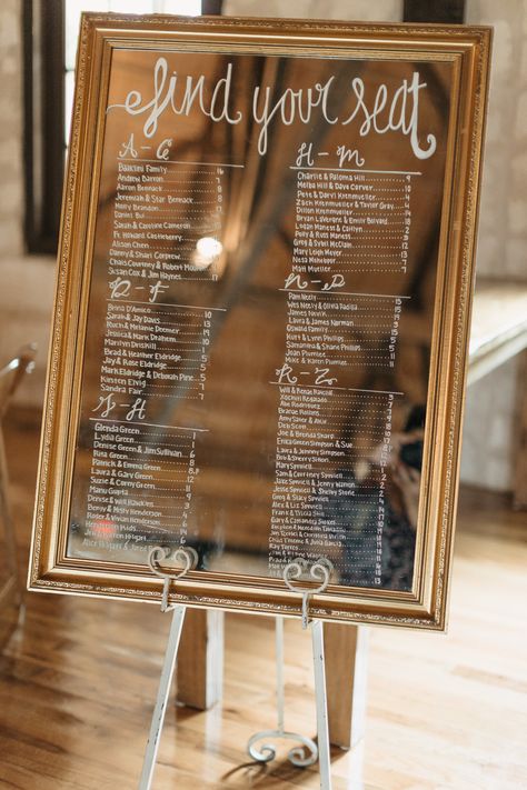 | mirror wedding sign ideas | wedding reception seating assignment sign | gold mirror wedding sign | wedding reception sign ideas | modern rustic wedding signs | modern rustic wedding decor | "find your seat" | weddings in houston | photo taken at THE SPRINGS Event Venue. follow this pin to our website for more information, or to book your free tour! SPRINGS location: Stonebridge in Magnolia, TX photographer:  Kristen Curette Photography #weddingdecor #weddingsign #weddingdecorations #weddingday Wedding Seat Assignment Ideas, Diy Find Your Seat Wedding Sign, Wedding Find Your Seat Ideas, Find Your Seat Mirror, Wedding Reception Seating Ideas, Find Your Seat Wedding Ideas, Reception Seating Ideas, Find Your Seat Wedding Sign, Mirror Wedding Sign