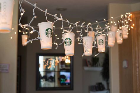 Starbucks Party Lights for all the coffee lovers out there. Created using Starbucks reusable cups and string lights for my beautiful daughter Gina, on her birthday. Photo by Gina Baker . Barista Birthday Party, Coffee Decorations Party, Coffee Birthday Party Ideas, Coffee Themed Party Birthday, Starbucks First Birthday, Coffee Party Ideas Decoration, Coffee Birthday Theme, Starbucks Birthday Ideas, Coffee Themed Party Decorations