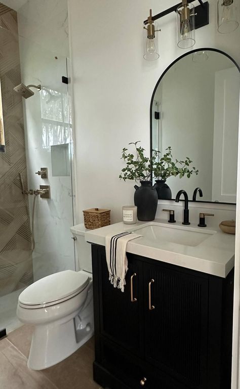 Restroom With Black Accents, White Walls Black Cabinets Bathroom, Half Bathroom Decor Black, Bathroom Decor Oak Cabinets, Black Cabinet Small Bathroom, Dark Vanity White Countertop, Black Toilet Powder Room, Brown Black Bathroom Ideas, Black White Neutral Bathroom