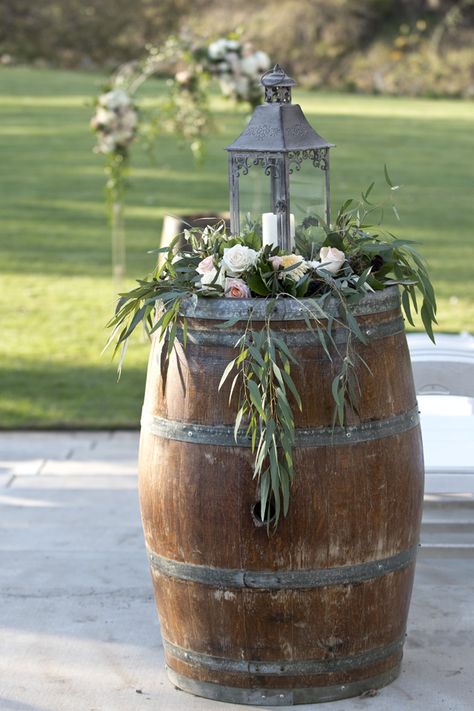 Lantern with hanging greens on wine barrel. Lori Makabe Photography. Deco Table Champetre, Wine Barrel Wedding Decor, Barrel Wedding Decor, Wedding Candy Cart, Wine Barrel Wedding, Wine Barrel Decor, Barrel Flowers, Whiskey Barrel Wedding, Barrel Wedding