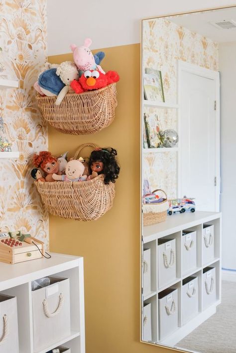 Modern and Bright Playroom Reveal Playroom Shelves Decor, Water Closet Organization Ideas, Hanging Toy Baskets On Wall, Playroom Ideas Dress Up, Plants In Playroom, Small Boho Playroom, Mirror In Playroom, Small House Playroom Ideas, Wicker Hanging Basket