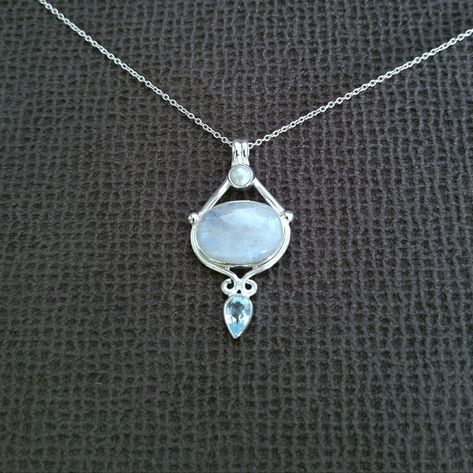 Brand New With Tags Shivam Rainbow Moonstone Pendant Necklace Excellent Condition With No Flaws Chain Length Approx 16" With 2" Extender Pendant Drop Approx 1-3/4" Width At Its Widest Point Approx 7/8" 925 Sterling Silver An Oval Shaped Rainbow Moonstone Sits Between A Tiny Round Freshwater Pearl And An Inverted Teardrop Shaped Light Blue Topaz Gemstone Made In India Please No Trades Or Lowballs! *Ask Any Questions You May Have Prior To Making An Offer Or Purchase Please* Moonstone Locket, Character Clothing, Moonstone Pendant Necklace, Style Reference, Rainbow Moonstone Pendant, Moonstone Necklace, Moonstone Pendant, Topaz Gemstone, Dream Jewelry