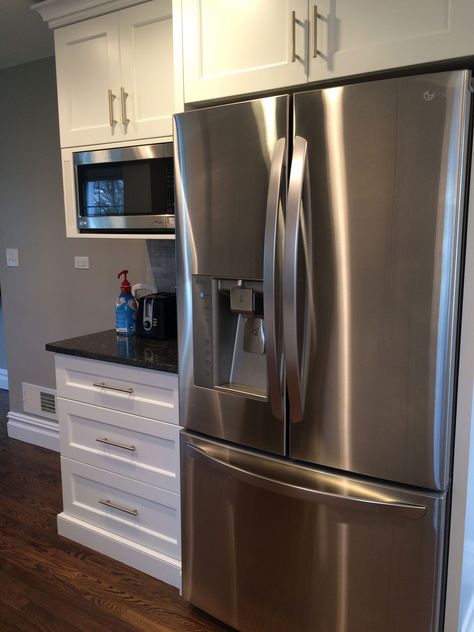 Love this LG SS fridge.  Next to it is a coffee station.  Coffee pot and toaster are on the counter.  Built-in microwave above with upper cabinets holding teas and bread spreads.  The first drawer below was made tall enough to hold coffee mugs and thermos.  Middle drawer has a bread drawer and a divider for coffee and sugar, creamer, etc. Small Kitchen Pantry, Tall Kitchen Cabinets, Refrigerator Cabinet, Tall Kitchen, Pantry Cabinets, Home Coffee Stations, Coffee Bar Home, Kitchen Pantry Cabinets, Cabinet Ideas