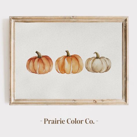 Add a touch of autumn elegance to your home with this "Pumpkins Watercolor Painting Print." This digital download features a beautiful arrangement of three pumpkins, delicately painted in watercolor with soft shades of orange, cream, and green. Each pumpkin is uniquely detailed, capturing the gentle blending of colors and the natural texture of watercolor. The minimalist design and light, airy background make this piece perfect for adding a subtle seasonal charm to your decor. Ideal for fall decorating, this print adds warmth and a festive touch to any room, from kitchens to living areas. This high-resolution digital file allows you to print the artwork in various sizes to fit your space perfectly. Enjoy the flexibility of a digital download that you can print as many times as you like for Watercolor Fall Background, Pumpkin Watercolor Art, Framed Watercolor Painting, Simple Autumn Painting, Simple Fall Watercolor Paintings, Fall Watercolor Paintings Easy, Easy Fall Paintings For Beginners, Watercolour Pumpkin, Fall Watercolor Paintings