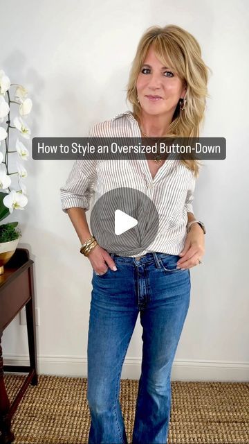 Tracey Rogers on Instagram: "An oversized button down is quickly becoming one of my favorite go-to’s. However, styling them can be tricky.   An easy way to style is to unbutton the bottom two buttons, twist the flaps twice, then tuck those in. I suggest tucking in the back as well if the top is oversized and long.   Rolling the sleeves always elevates the look, but it’s hard to make them stay up. So instead of a normal sleeve roll, pull the sleeve up to the length you want it to be, then add a roll on top of that!  Common “Shop” and I’ll send you links to some of my favorite oversized blouses (if it doesn’t state that it’s oversized, order at least one size up).   #fashionover50 #fashionover40 #over50style #over40style #wearingtoday #outfitsstyling #ootddetails #outfitinspiration  #cuteout Wearing Oversized Button Up Shirts, How To Tie Bottom Of Shirt, Button Down Shirt Hacks For Women, How To Wear A Blouse With Jeans, How To Roll Up Sleeves, How To Style Long Sleeve Button Up, Styling An Oversized Button Up, Oversize Blouse Outfit, How To Wear Oversized Shirt