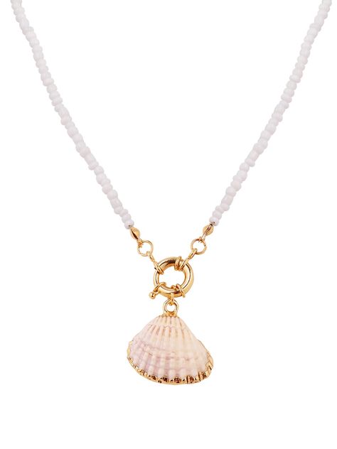 PRICES MAY VARY. Seashell is the symbol of the ocean, water, feminine energy and is associated with fertility, birth and prosperity Handcrafted from a genuine seashell, ceramic beads and an elastic string Shell pendant measures about 1.1 x 0.8 inch (2.7 x 2 cm), necklace length 15.7 inches (40 cm) Make a statement this summer with this classic handmade bohemian style shell choker necklace The perfect beaded white seashell necklace choker to wear on summer vacation or on the beach Necklace For Neckline, Shell Charm Necklace, Hippie Summer, Summer Board, Vacation Jewelry, Shell Choker, Coastal Grandmother, Beach Necklace, Beach Necklaces