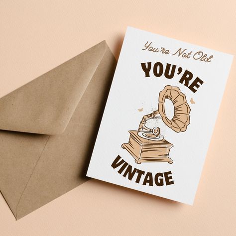 "Celebrate the timeless classic in your life with our Vintage Gramophone Birthday Card Printable. With a charming nod to the past, this card exclaims, \"You're Not Old, You're VINTAGE,\" perfect for the person in your life who ages like fine wine. This printable birthday card is ideal for those with a love for all things retro and a sense of humor about getting another year older. 🎵🎉 This is an instant download greeting card. Please note that nothing physical will be shipped and no envelopes are included. This file is NOT editable and comes as is. The inside is blank so you can fill in your own messages. 🎂 Why You'll Love Your Printable Birthday Card: - Instant Download: Get it right away, print at home or at your local print shop. - Personal Touch: Add your handwritten note for that ex Vintage Birthday Cards Retro, Birthday Card For Grandpa, Materinski Dan, Dan Žena, Card For Grandpa, Grandpa Birthday Card, Vintage Gramophone, Birthday Card With Photo, Vintage Birthday Card