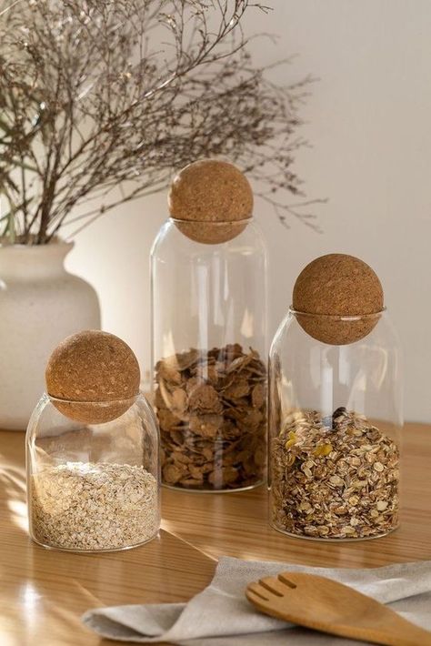 This Set of 4 Sleek Pantry Jars offers a stylish and practical way to keep your pantry organized. Made with high-quality glass and airtight lids, these jars are perfect for storing dry goods. Their modern design adds a touch of elegance to your kitchen décor, while their transparent glass body allows you to quickly identify the contents. Simplify your pantry organization with this stylish Set of 4 Jars. Glass Jar Storage, Glass Jars Kitchen, Cork Ball, Jars Kitchen, Pantry Jars, Pantry Containers, Sugar Storage, Gardening Design, Jar Storage