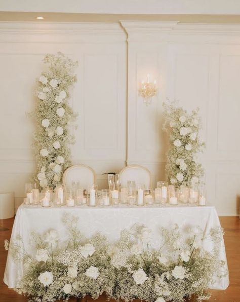 Babies Breath Sweetheart Table, Babys Breath Wedding Florals, Sweetheart Table Flower Arrangements, Pearl Accents Wedding, White Sweetheart Table, Head Table Florals, Sweetheart Table Candles, Wedding Flower Arrangements Church, Wedding Centerpieces Elegant