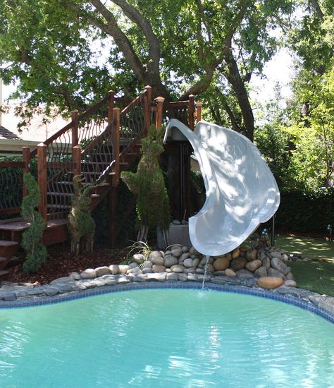 This homeowner stepped out of the box when she added a beautiful 15.5' Dolphin slide to her pool. The gorgeous stairway landing adds a simple elegance to the wa… Pool Slide Diy, Inground Pool Slides, Above Ground Pool Slide, Water Slides Backyard, Swimming Pool Slides, Pool Water Slide, Swimming Pool Design Ideas, Stock Pools, Yard Makeover