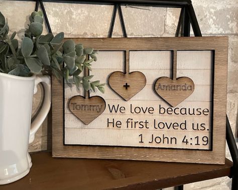 Personalized Valentines Day Gift.  You + Me frame will be the perfect gift for you the one that you love. Our farmhouse sign makes the perfect gift.   1 John 4:19 bible verse is engraved on a distressed faux shiplap board, with personalized hearts layered on top. This heart frame comes with 3 hearts. For other heart frame options, please see our shop. Bible Verse For Her, Church Valentines, Rustic Valentine Decor, Valentine Craft Decorations, Farmhouse Valentine Decor, Valentine Wood Crafts, Spouse Gifts, Christian Christmas Gift, Christian Valentines