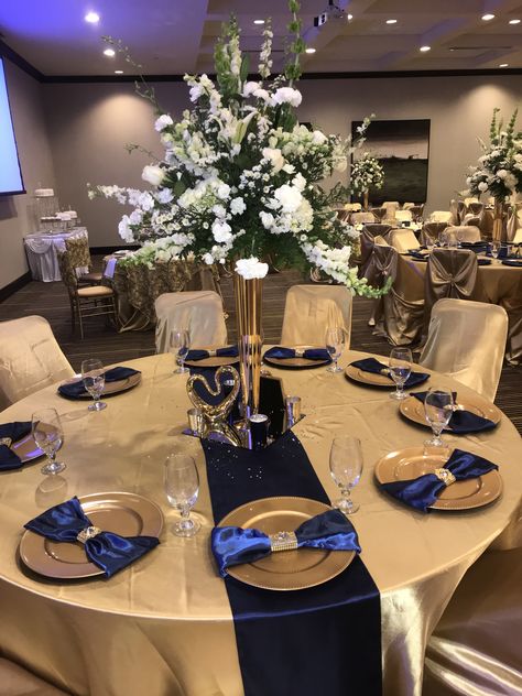 Navy Gold And White Wedding Decor, Navy Blue White And Gold Wedding Centerpieces, Navy Blue White Gold Wedding, Dark Blue And Gold Centerpiece, Center Pice Ideas, Royal Blue And White Wedding Decor, Navy Gold Table Decor, Navy Gold Decorations, Blue And Gold Backdrop Party Ideas