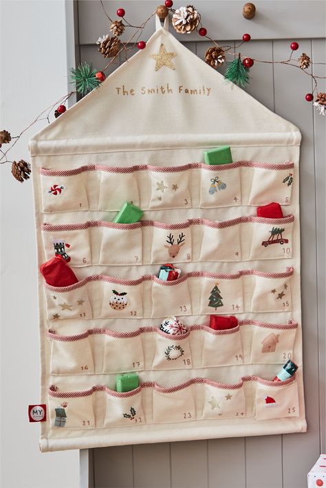 Get your little angel excited for Christmas with our personalised hanging advent calendar. This advent calendar is woven from a soft cream material and decorated with festive illustrations, including a red-nosed reindeer, tasty pudding and mistletoe. Hanging Advent Calendar, Advent Calendar Pattern, Homemade Advent Calendars, Excited For Christmas, Fabric Advent Calendar, Quilting 101, Christmas Quilt Patterns, Scrap Fabric Projects, Diy Advent Calendar