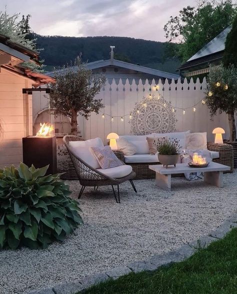 a modern boho patio with wicker seating furniture, a fire pit, a boho chair, some trees, lights and decor Small Garden Waterfalls, Boho Patio, Backyard Balcony, Backyard Inspiration, Outdoor Gardens Design, Backyard Garden Design, Backyard Makeover, Garden Seating, Backyard Patio Designs