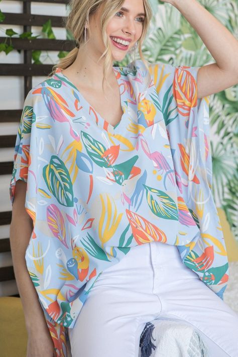 Looking for a cute and casual top to wear this summer? Check out our Summer Palm Kaftan Top! This pretty leaf-print kaftan is perfect for throwing on over your swimsuit or pair it with shorts or jeans for a day out. The V-neckline is flattering and the chest pocket is handy for carrying your essentials. Made from a lightweight, unlined fabric, this top is comfortable and easy to wear. Choose from several pretty colors and pattern options. Made from light and airy fabric, this top is perfect for Kaftan Tops With Jeans, Tops With Jeans, Kaftan Tops, Pretty Leaf, Flowy Tops, Whats New, Casual Top, Pretty Colours, Leaf Prints