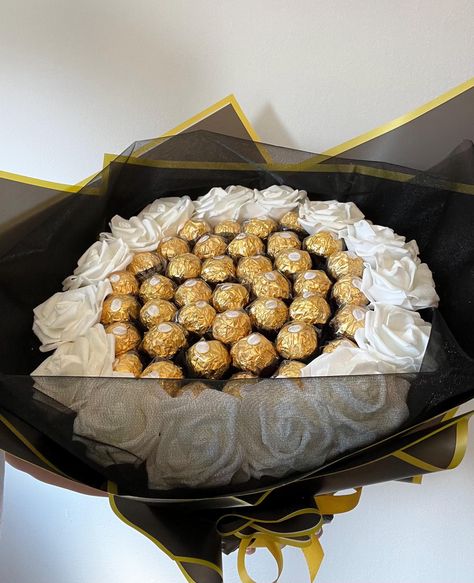 Indulge in the ultimate combination of luxury and sweetness with our exquisite Ferrero Rocher white, Black and Gold Chocolate Glitter Rose Bouquet This stunning bouquet is an ideal gift for someone special on their special day, be it a birthday or any other occasion.  The bouquet features a beautiful blend of white regular or glitter roses and gold Ferrero Rocher chocolates that look visually stunning together. The chocolates are elegantly arranged with red glitter roses to create an alluring and elegant look that is sure to catch the eye of your loved one. Our chocolate bouquet is crafted with meticulous attention to detail, ensuring every component looks perfect in its place. The chocolates are carefully wrapped in elegant packaging for added appeal Flower Bouquet Gift Ideas, Rose Flower Bouquet Gift, Red Glitter Roses, Bouquet Gift Ideas, Chocolate Ferrero Rocher, Ferrero Rocher Bouquet, Bouquet Business, Flower Bouquet Gift, Rose Flower Bouquet