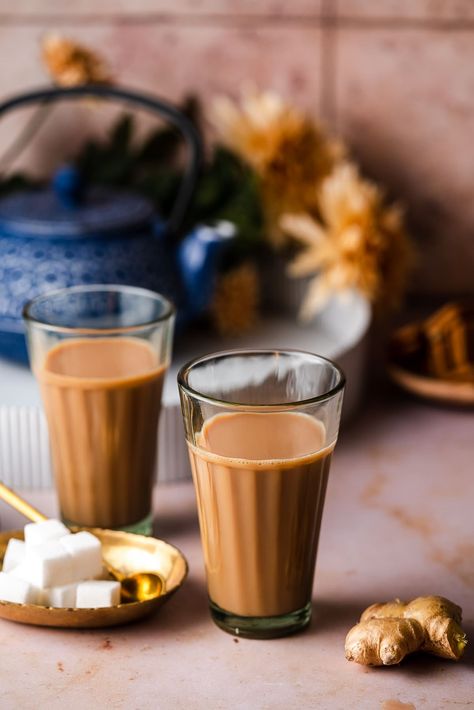 Enjoy a hot cup of Indian-Style Ginger Tea, or Adrak Chai, for an afternoon pick-me-up. This tea is brimming with the anti-inflammatory benefits from fresh ginger in a delicious, easy-to-make milky black tea. Spiced Tea Recipe, Masala Chai Recipe, Vegan Pantry, Masala Tea, Chai Recipe, Indian Tea, Masala Chai, Ginger Tea, Food Pantry