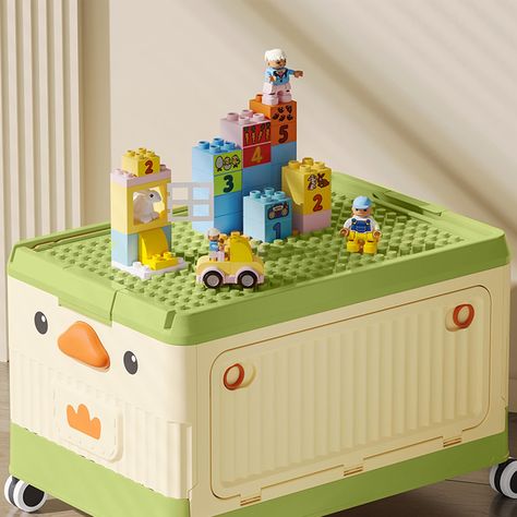 PRICES MAY VARY. 【Combining Toy Storage and Play】The storage box design is unique, and the top bottom plate can be compatible with your existing bricks. You can build towering mansions, majestic castles, bustling cities, and anything you can imagine. 【Easy to Move】The children's toy box is equipped with wheels, measuring 16.9 x 11.4 x 9.4 inches, weighing 3 pounds, lightweight, and small in size, making it easy to replace children's favorite toys. This is a toy box and a mobile game standing tog Toy Box Ideas, Storage Box Design, Block Storage, Childrens Toy Boxes, Childrens Toy Storage, Stackable Storage Boxes, Clear Storage, Lego Blocks, Plastic Storage Box