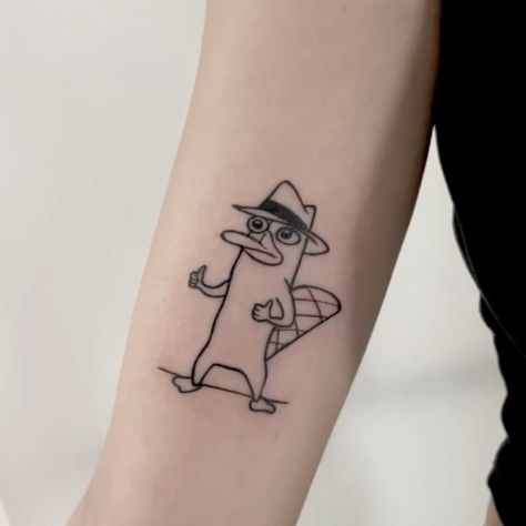 #TattooArt #InkLife #BodyArt #TattooInspiration #InkedUp #TattooLove #TattooedWomen #TattooedMen #InkCommunity #TattooStories Perry The Platypus Tattoo, Platypus Tattoo, Crazy Tattoos, Perry The Platypus, Platypus, Instagram Page, Tattoos