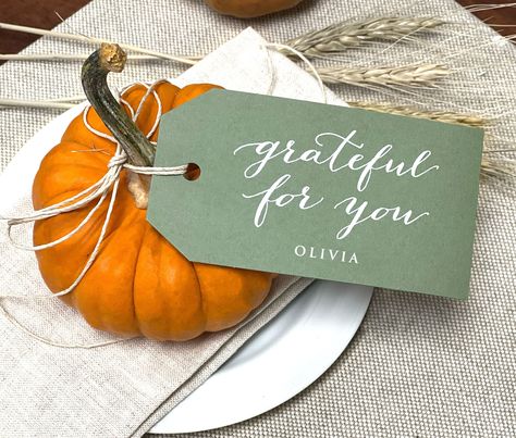 "Thanksgiving Personalized Place Card Tags, Printed Thanksgiving Name Cards, great for Napkin Tags! These printed Thanksgiving Tags are perfect for setting your best Thanksgiving dinner table. Tie one of these grateful for you tags to napkins at each table setting, on tiny little pumpkins, or on little Thanksgiving favor gift bags for each individual guest at your festive gathering. Each customized gift tag is printed on high quality colored card stock with new modern white ink printing. Gratefu Thanksgiving Place Settings, Thanksgiving Name Cards, Thanksgiving Tags, Thankful And Grateful, Place Settings Thanksgiving, Thanksgiving Favors, Weddings Idea, Thanksgiving Napkins, Thanksgiving Place Cards