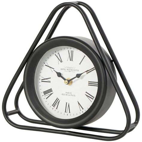 Place this metal clock on a bookshelf or bedside table as a decorative accent piece, or as functional time-keeping device. Requires 1 AA battery, not included. This item ships in 1 carton. Metal clock has a white face with black Roman numerals and black hands. The clock mechanism runs silent. Iron clock makes a great gift for any occasion. Suitable for indoor use only. This item ships fully assembled in one piece. This is a single black colored mantel clock. Modern style. Clock face features the Geometric Clock, White Clocks, Black Hands, Shelf Clock, Metal Clock, Mantel Clocks, Modern Clock, Tabletop Clocks, Clock Decor