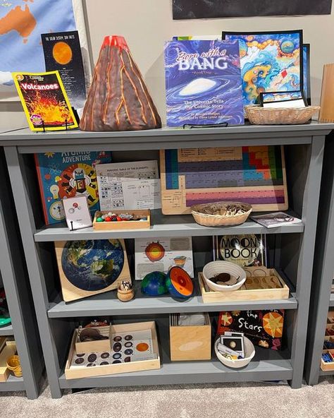 Jenna on Instagram: "🌋 🪐 First Great Lesson Activities 🧬 🌟 We have been continuing our study of the formation of the universe by using some of these wonderful resources. I plan to fill this shelf with materials that correspond to each great lesson. We will finish up the study of the 5 Great Lessons by the end of January, and then we will focus on geography by doing detailed continent studies. On this shelf: 🌋 Volcano model (@learningresources ) 🌟 Cosmic Story Mat (@wasecabiomes ) 🧪 Molecu Volcano Unit Study, Therapist Activities, Preschool End Of Year, Montessori Elementary Classroom, Volcano Model, Homeschool Room Design, Reggio Emilia Classroom, Montessori Geography, Lesson Activities