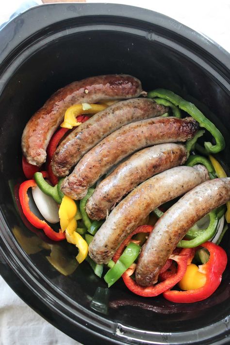 These Slow Cooker Sausages with Peppers and Onions is a no fuss meal with TONS of flavor! Serve with your favorite marinara to make it complete! Sausages And Peppers, Slow Cooker Sausage Recipes, Sausage And Peppers Crockpot, Sausage Crockpot Recipes, Sausage Slow Cooker, Sausage Crockpot, Italian Sausage Recipes, Crockpot Recipes Beef, Crock Pot Slow Cooker