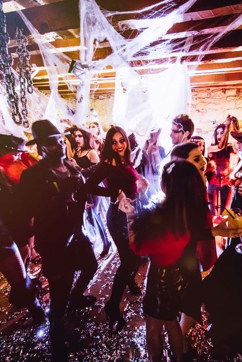 Multi-ethnic people in Halloween costumes having fun at dungeon nightclub Horror Movie Night, Halloween Club, Black Halloween Dress, Halloween Songs, Apocalypse Survival, Adult Party Games, Halloween Party Games, Halloween Party Themes, Glow Party