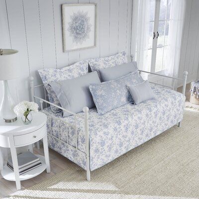 The daybed set combines modern elegance with timeless style. Constructed with quality cotton, the daybed, and standard shams feature a blue floral design on the classic white ground, while the included coordinating bolster pillow cover can be used as a comfy backrest. This versatile daybed set fits any décor and can be used in a bedroom, living room, or home office. The daybed set is filled with a cotton/polyester blend and is lightweight, ideal for year-round use. The set includes one daybed co Laura Ashley Sheets, Daybed Bedding Sets, Blue Daybed, Daybed Sets, Laura Ashley Bedding, Daybed Cover Sets, Daybed Bedding, Laura Ashley Home, Cotton Quilt Set