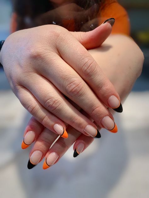 Halloween Orange French Tip Nails, Nail Ideas Orange And Black, Black Orange French Tip Nails, Black And Orange Nails French Tip, Black And Orange Tip Nails, Orange Tip Halloween Nails, Black And Orange French Tip Nails Halloween, Halloween Nail Tips French Manicures, Black And Orange Almond Nails