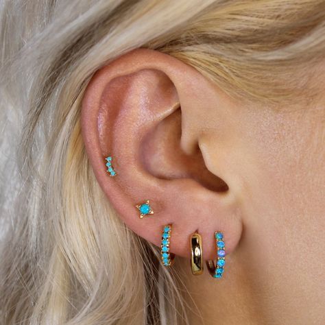 Our Turquoise Pavé hoops feature turquoise coloured cz stones and are crafted in 925 Sterling Silver and coated in thick 18k gold plating making them hypoallergenic and safe for everyday wear. The earrings feature a snap closure making them easy and comfortable to wear. Measuring at 8mm inner diameter, 10mm outer diameter. Sold as a pair.  Create your dream ear stack with our hoops and huggie earrings.  All jewellery comes in a gift pouch/box ready to be gifted. Remove before exercise.