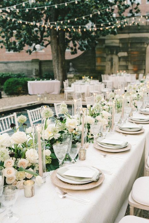 Timeless and elegant wedding tablescpape adorned with white roses and touches of greenery | wedding tablescape, wedding table decor ideas, wedidng tablescapes, table decorations, wedding table decor ideas, wedding reception, wedding reception decorations, wedding reception decor ideas, table settings, wedding flowers, floral centerpieces, flower arrangements, floral inspiration,floral installation, wedding planning, wedding florist,romantic wedding decor, elegant wedding decor,2023 wedding,roses Rectangular Table Flower Arrangements, Long Table Arrangements Wedding, Wedding Table Dressing, Wedding Decor White And Green, Centerpieces For Long Tables, Long Table Flower Arrangements, Table Decorations Wedding Table Decor, Wedding Reception Table Flowers, Wedding Decor 2023