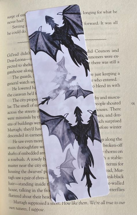 Dragon Bookmark | Fantasy Themed Bookmarks | Romantasy Themed Bookmark | Handmade Bookmarks | Bookish Gifts | Gifts for Readers The perfect reading companion for fantasy book lovers. Created using 74 lb doubled-sided luster photo paper. The double-sided luster photo paper has a unique texture, and it is also flexible for those who prefer a more flexible bookmark. Pattern is printed on one side only, reverse side is white. Features: - materials: bookmarks are printed on 74 lb luster photo paper. Diy Dragon Bookmark, Book Art And Craft, Bookmarks For Book Lovers, Dragon Book Mark, Bff Bookmarks, Cute Wings Drawing, Pop Up Bookmark, Things We Never Got Over Bookmark, Fantasy Book Mark Ideas