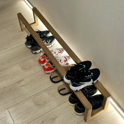 This stylish wooden shoe rack is the perfect solution for those who appreciate minimalism and order in the house. Natural materials, simplicity and functionality! #shoerack #woodenshelf, #shoestorage #minimalistfurniture, #organizeyourhome#minimalistdesign#interiordecor #scandinavianstyle#homedecorideas#nordichome#ecofriendlyliving#sustainablehome#ecofurniture#smallspaceliving #homedecorUSA#interiordesignuk #homestylingEurope Small Entry Shoe Rack, Shoe Storage Ideas Entryway, Shoe Rack With Hooks, Shoe Shelf Diy, Wooden Shoe Rack, Wood Shoe Rack, Wooden Shoe Racks, Shoe Rack Entryway, Shoe Storage Shelf