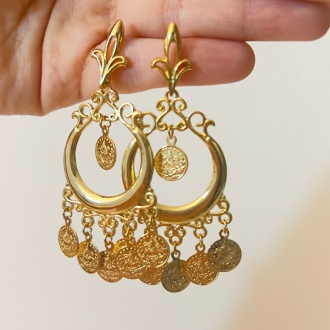 Hi there! A fine set of earrings from the Arabian heritage. 21K gold plated with coins. Wear it to your photoshoot, henna party, or as a wedding guest. Or on Eid! This piece falls under the category of gold imitation. It has the same design as real gold pieces sold in the Middle East. Enjoy it! Since this piece is gold plated, please wear it gently as its color should last you much more than any other piece of jewelry. Please avoid washing or scratching the plating away, and keep out of contact with creams and perfumes.  Any question? Want this as a gift to someone? Please message me! I will be very happy to help. Since I am just starting off this business, please know that no returns, refunds, or cancellations will be supported. Thanks for your understanding! Arabian Jewelry Gold, Arabian Earrings, Arab Earrings, Arabic Earrings, Egyptian Belly Dance, Gold Ottoman, Egyptian Gold, Turkish Lira, Arabic Jewelry